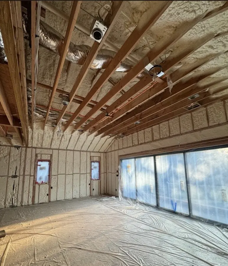 Interior walls and ceiling insulated with spray foam during new construction in Youngtown